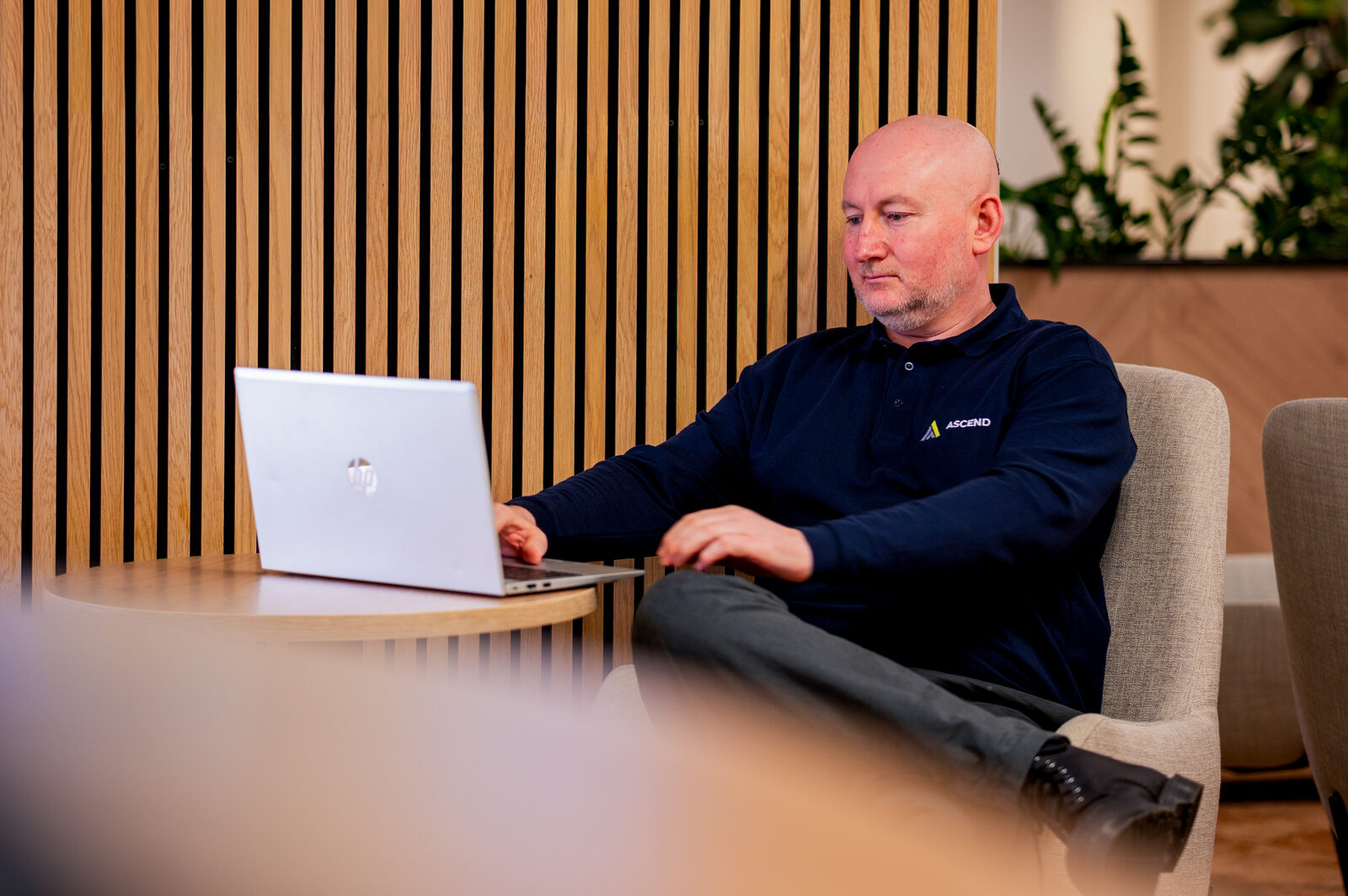 James Wooton of Ascend working at a laptop