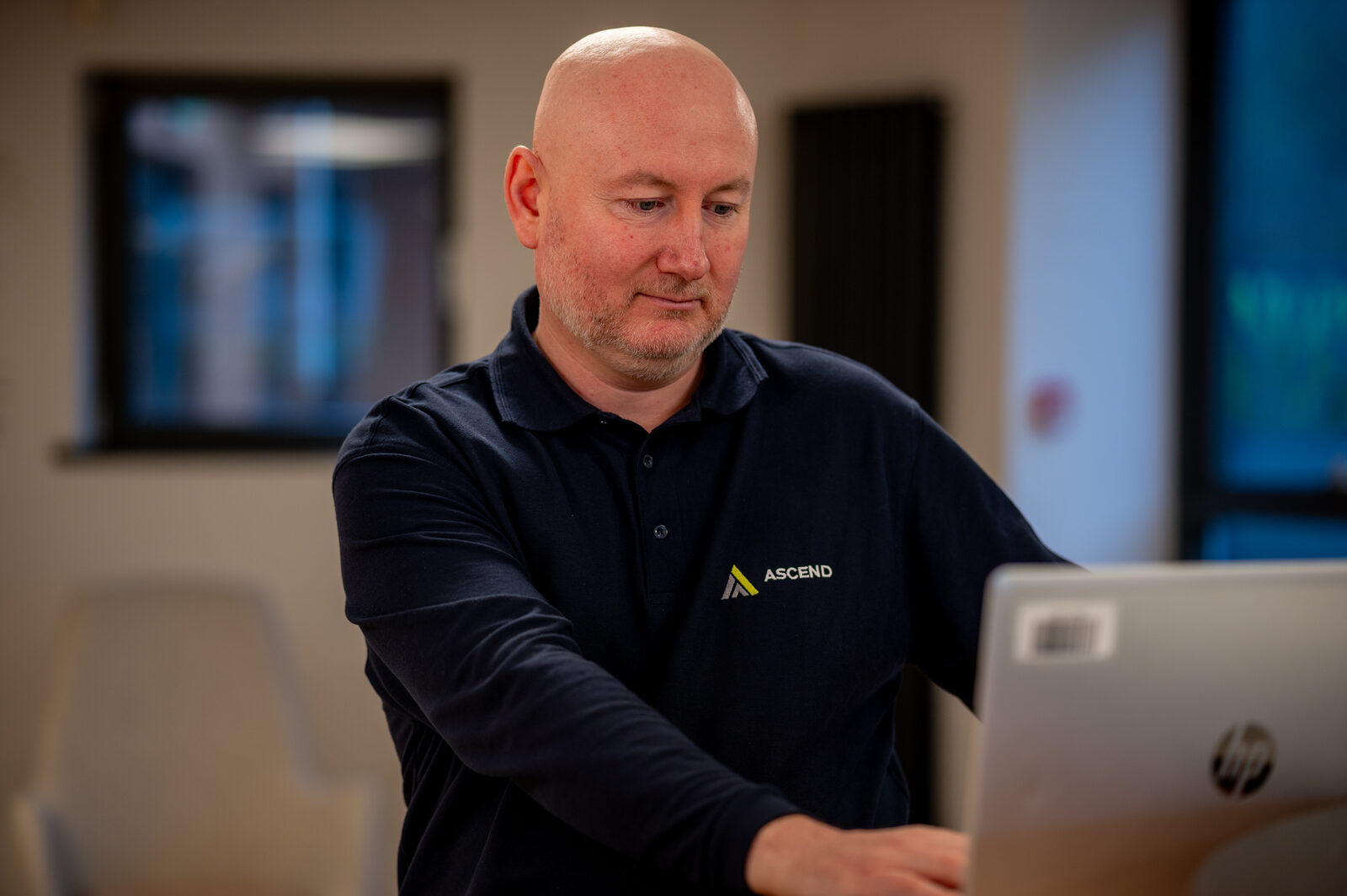 James Wooton portrait in branded Ascend polo