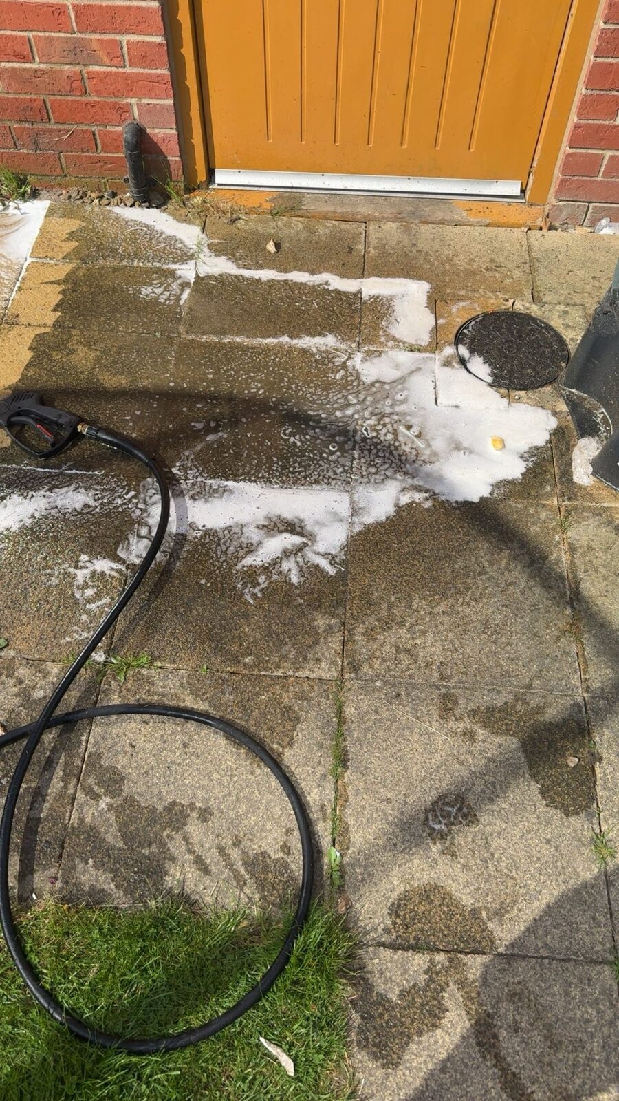 Patio being pressure washed