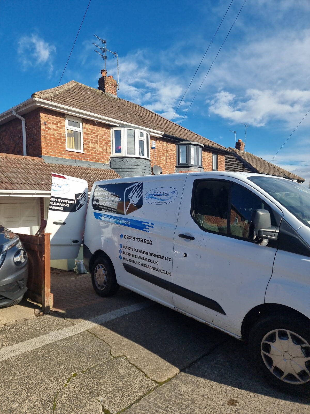 Buddy&rsquo;s van outside a customer&rsquo;s home
