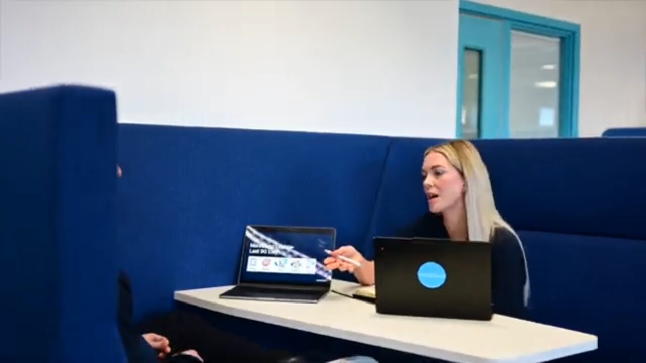 Team member working in a collaboration booth