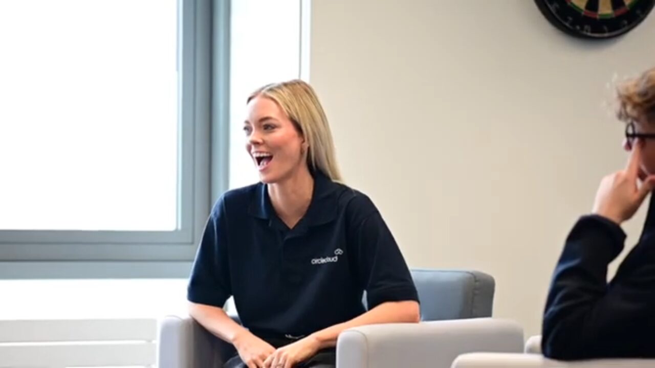 Circle Cloud team member laughing in the breakout area