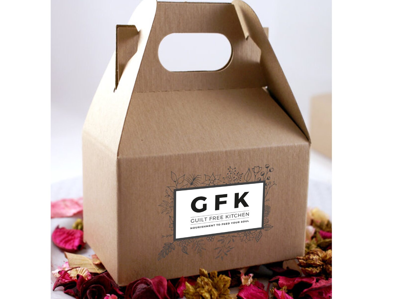 GFK monogram concept on a kraft carry box