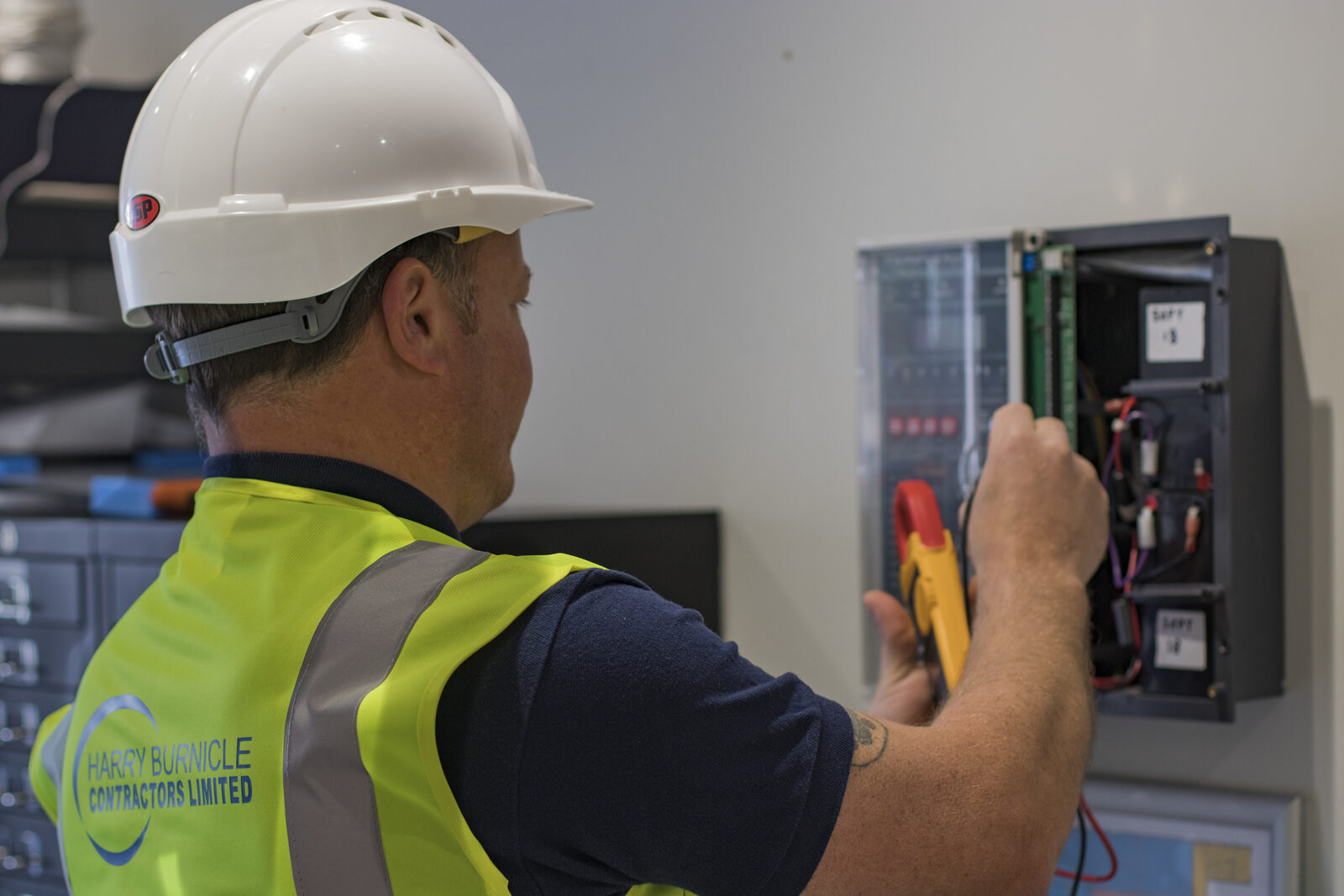 Harry Burnicle engineer testing a fire alarm panel
