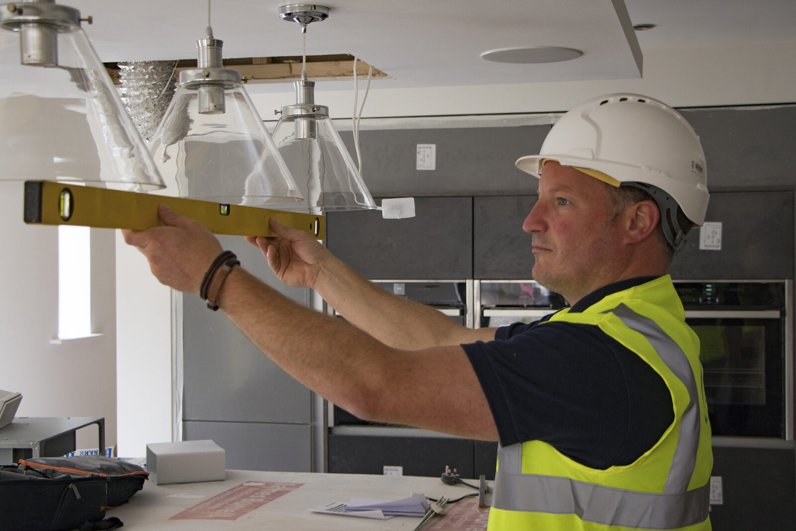 Harry Burnicle engineer levelling kitchen pendant lights