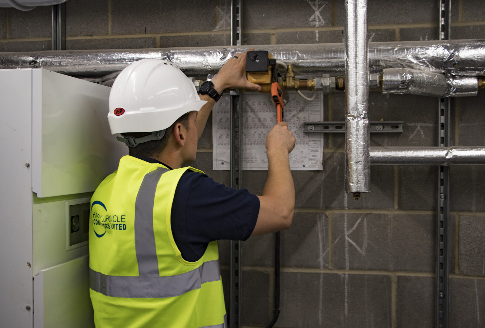 Harry Burnicle engineer working in a plant room