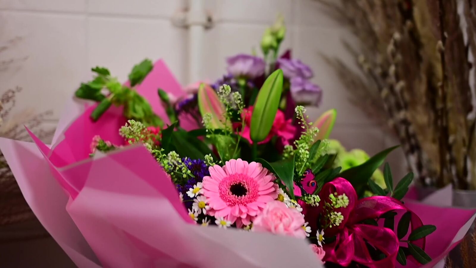 Florist arranging a bouquet in her shop