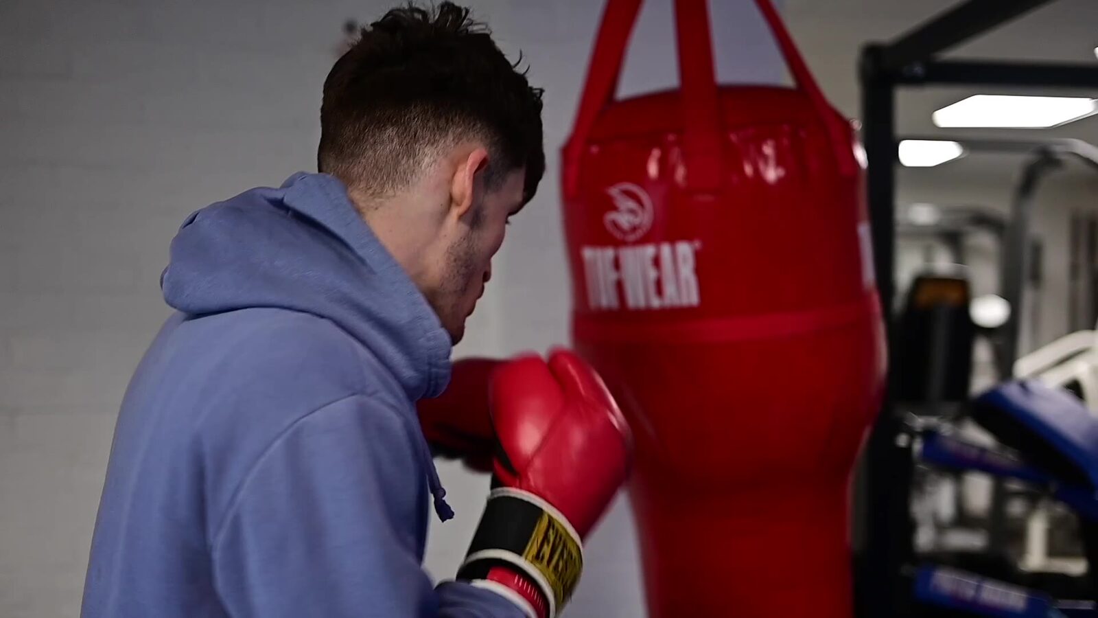 Gym owner training on a punch bag in the Enterprising Sunderland start-up film