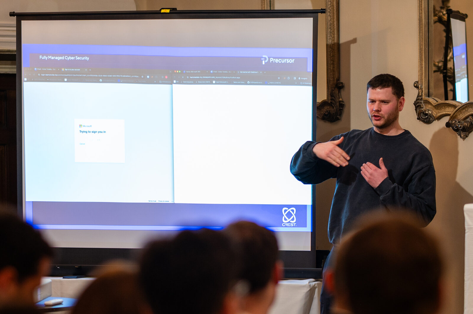 Presenter at the screen during the cyber security event