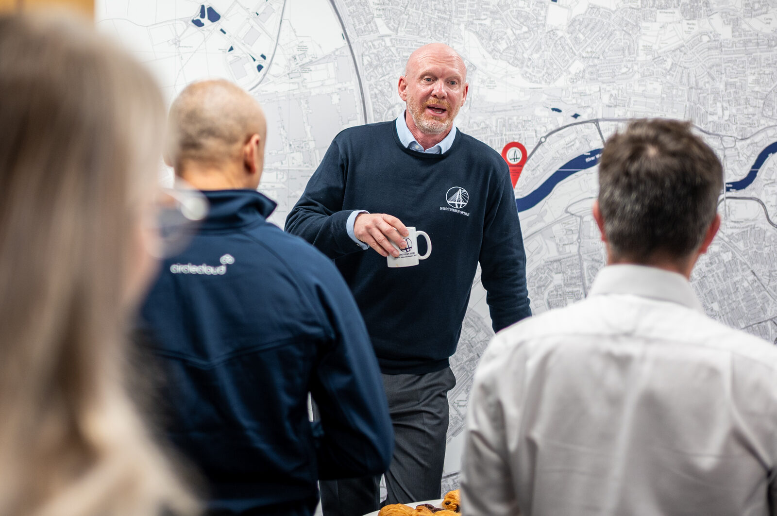 Guests talking by the Sunderland map wall