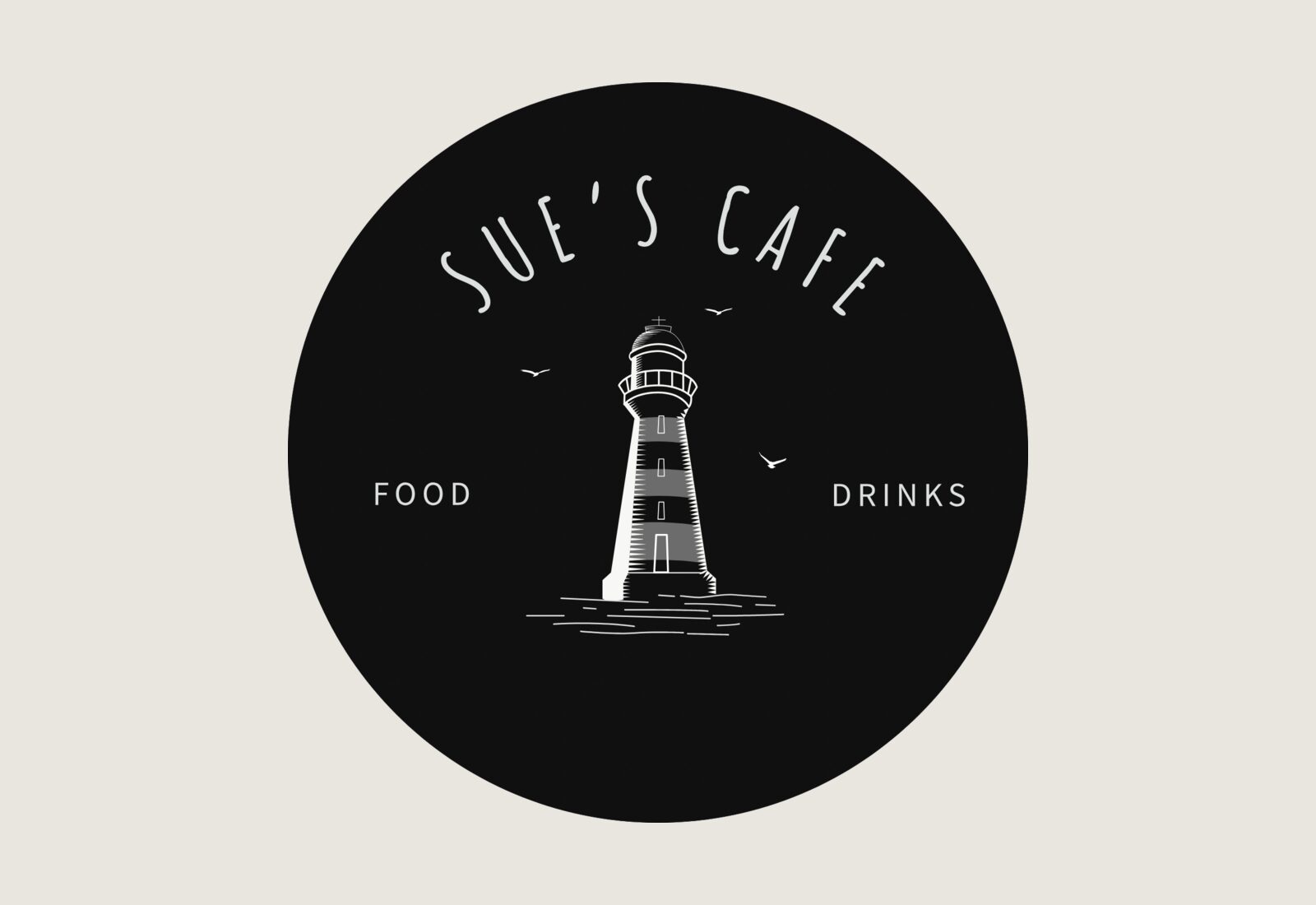 Sue&rsquo;s Cafe round lighthouse sign